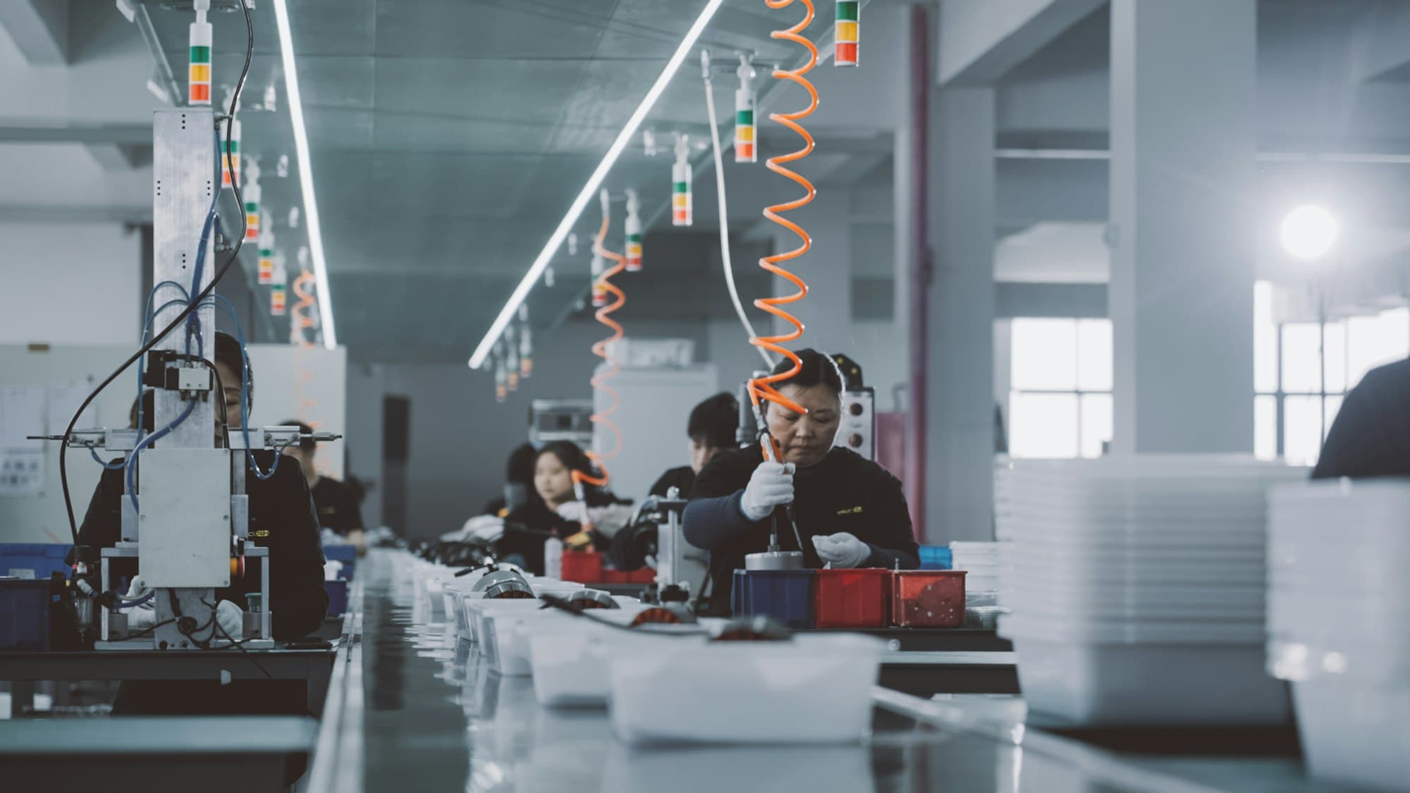 Workers on a factory production floor