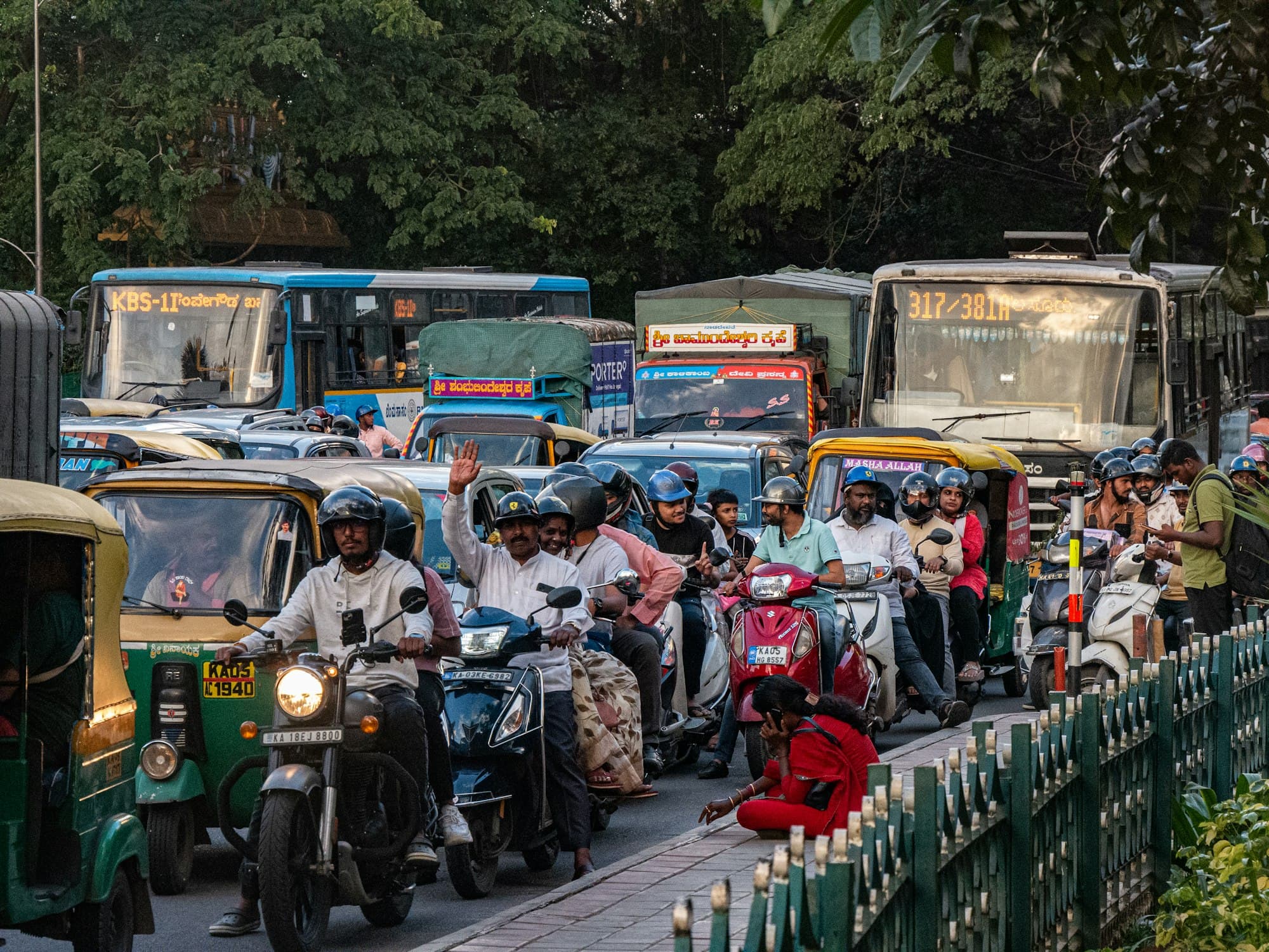 Scooters and buses in city traffic